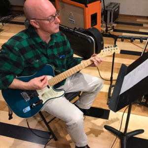 Mark (owner) at a Western North Carolina Recording Studio playing the guitar